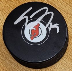 Autographed TRAVIS ZAJAC New Jersey Devils Hockey Puck