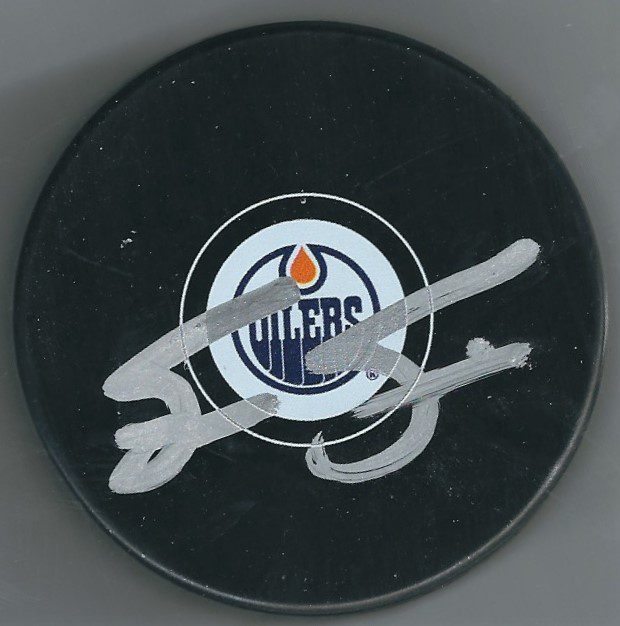 Autographed STEVE SMITH Edmonton Oilers Hockey Puck - Main Line Autographs