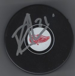 Autographed Dennis Cholowski Detroit Red Wings Hockey Puck
