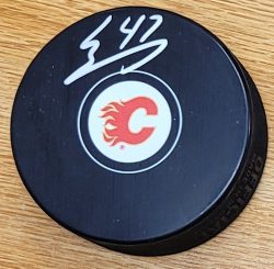 Autographed CONNOR ZARY Calgary Flames Hockey Puck