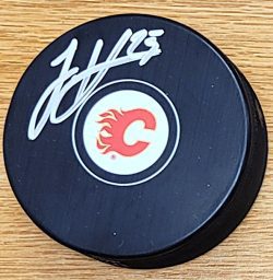 Autographed JUSTIN KIRKLAND Calgary Flames Hockey Puck