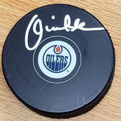 Autographed LOUIE DEBRUSK Edmonton Oilers Hockey Puck